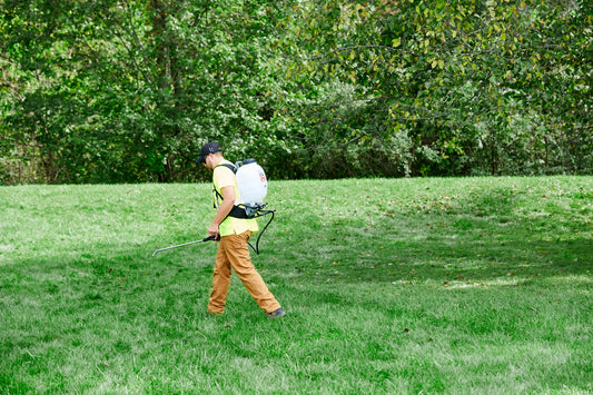 Field King Max Pro backpack sprayer in use on a lawn
