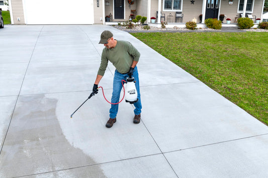 Smith M200EP sprayer cleaning a driveway