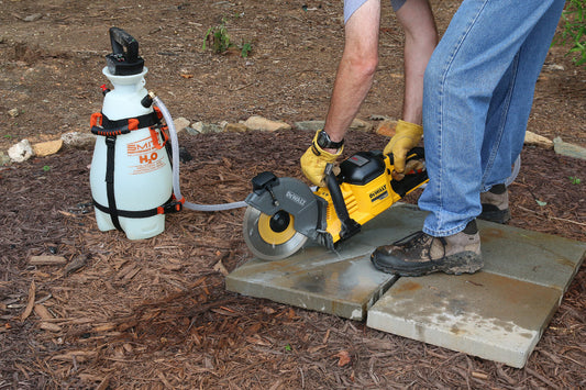 Smith water supply tank feeding a masonry saw
