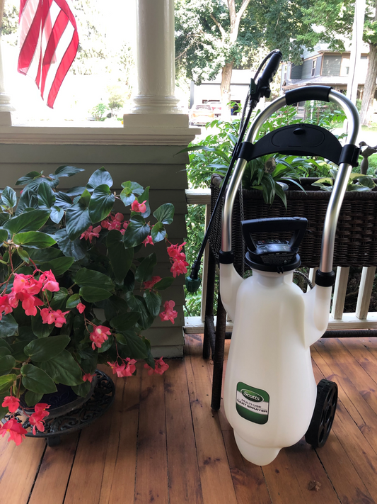 Scotts battery cart sprayer on a porch