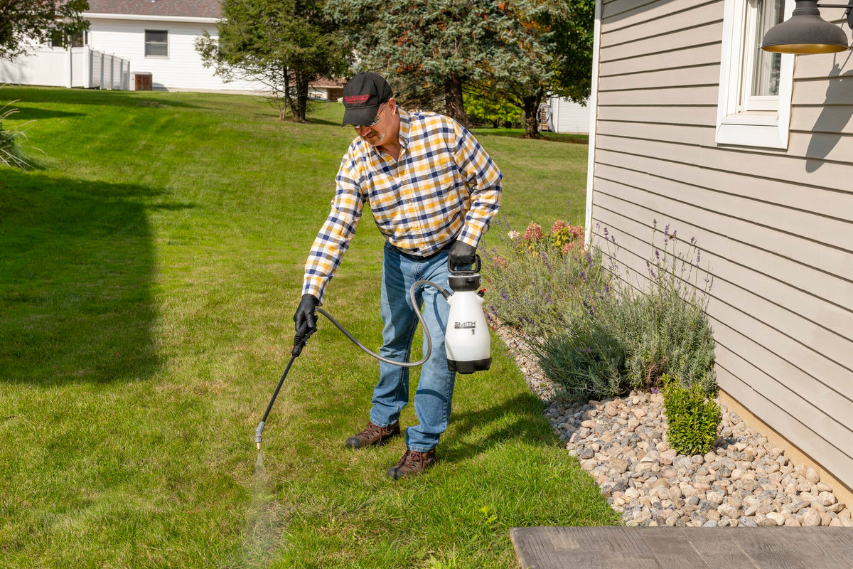 Smith Multi-Use 1 Gallon sprayer in use on landscaping