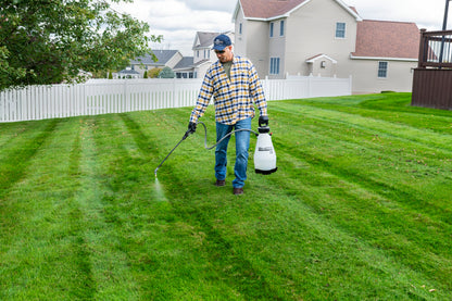 Smith Multi-Use 3 Gallon sprayer treating a lawn
