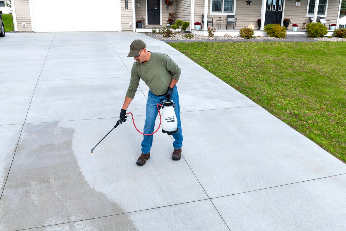 Smith M200EP sprayer cleaning a driveway