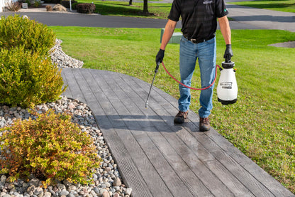 Smith M200EP sprayer treating a walkway
